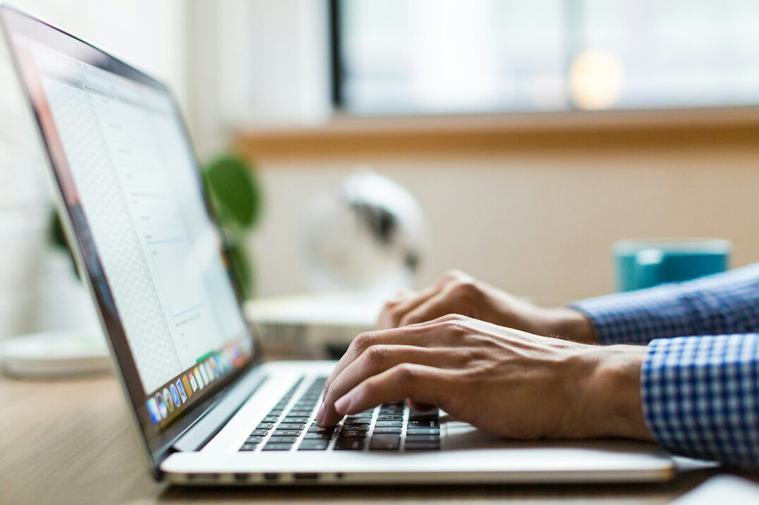 blogger typing on computer