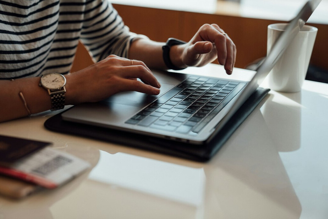 blogger typing on computer